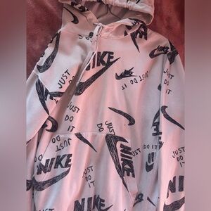 Small white Nike hoodie with black Nike logo’s